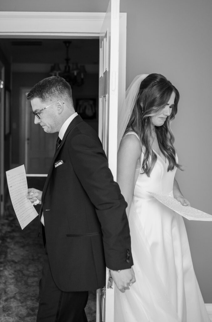 A bride and groom exchanging intimate private vows before their wedding ceremony at Primrose Cottage in Roswell Georgia
