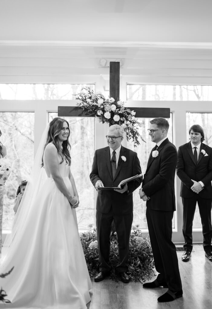A bride and groom exchanging vows on their wedding day at Primrose Cottage in Roswell Georgia
