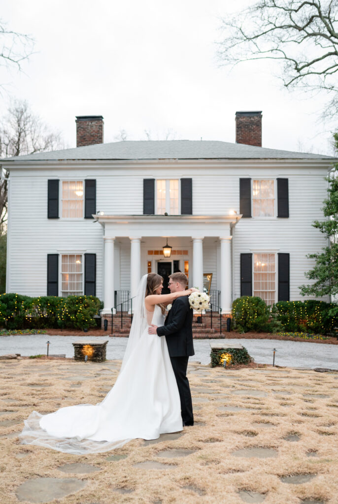 A bride and groom taking timeless couples photos after their wedding ceremony at Primrose Cottage in Roswell, Georgia