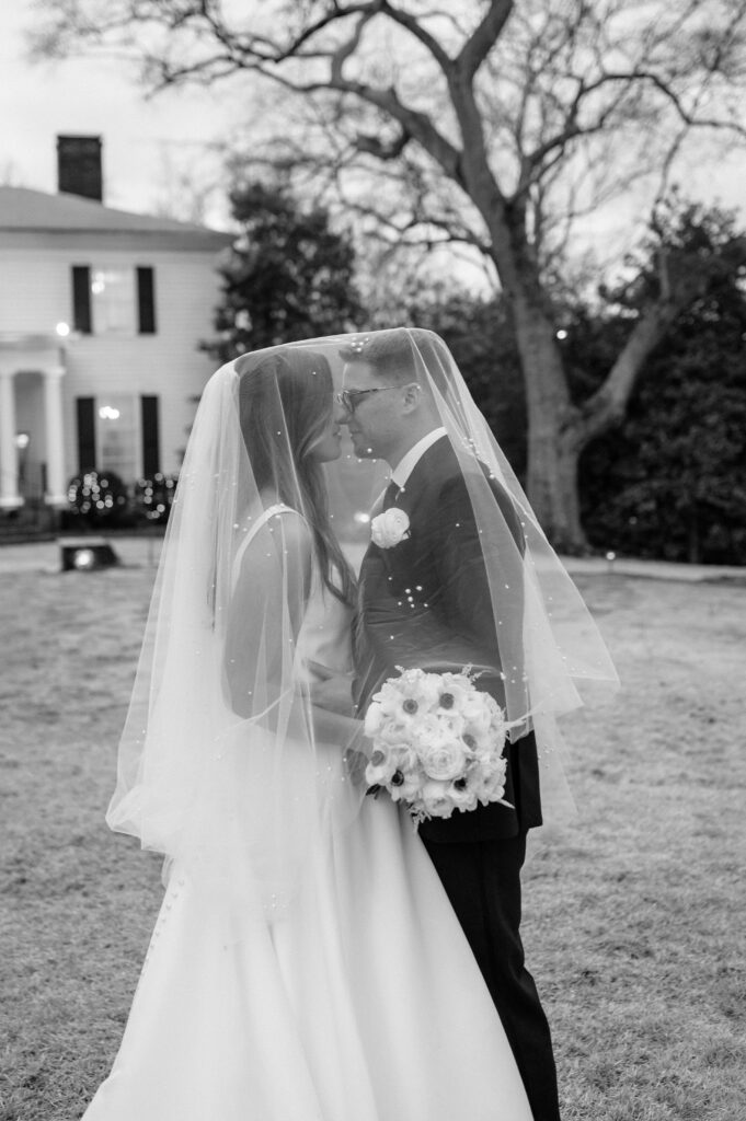 A bride and groom taking timeless couples photos after their wedding ceremony at Primrose Cottage in Roswell, Georgia