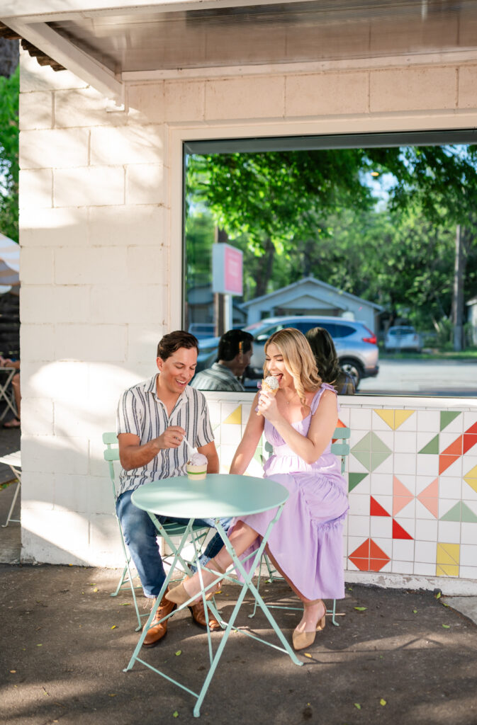 An engaged couple taking their engagement photos at an ice cream shop in Austin Texas