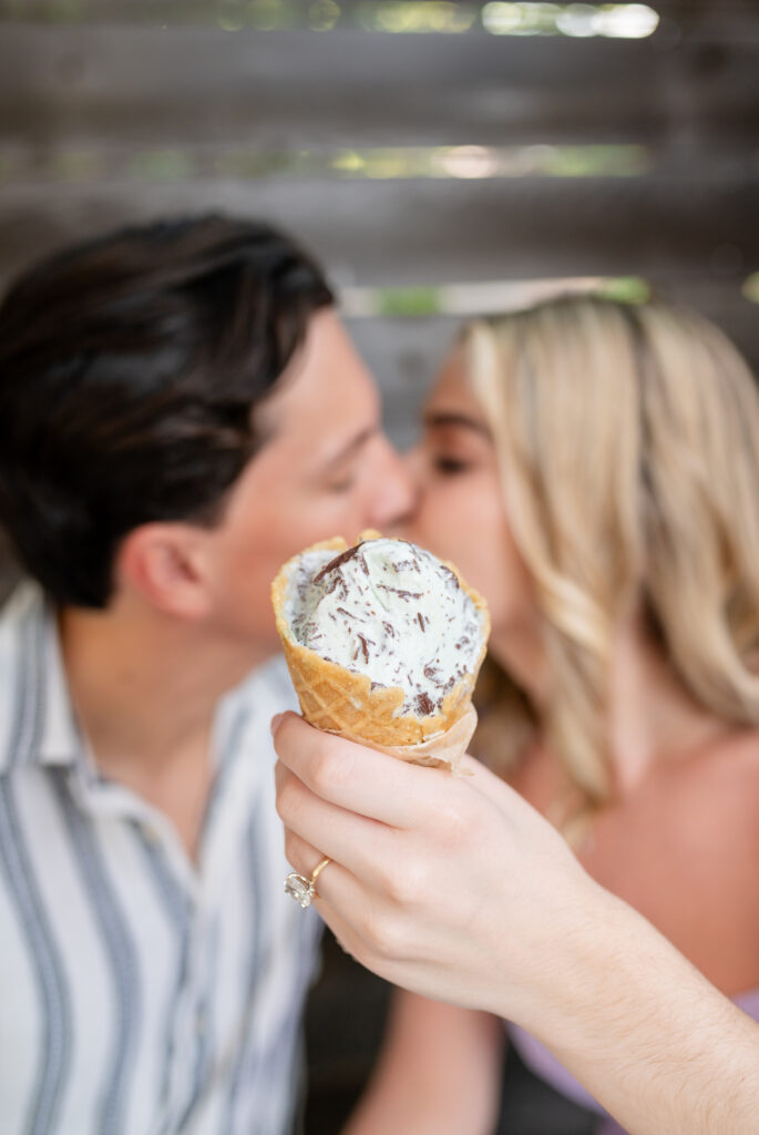 An engaged couple taking their engagement photos at an ice cream shop in Austin Texas