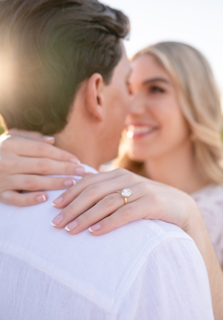 An engaged couple taking their engagement photos at Mckinney Falls State Park in Austin Texas