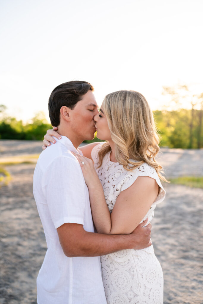 An engaged couple taking their engagement photos at Mckinney Falls State Park in Austin Texas